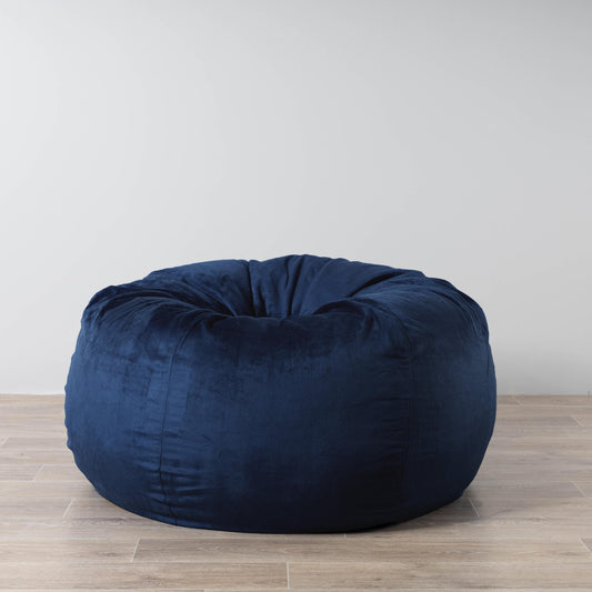 Navy blue round bean bag with soft plush fabric and visible stitched seams