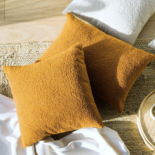 Mustard teddy boucle cushion covers, plush textured fabric in stacked close view