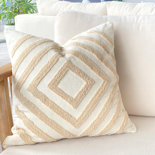 Tufted cushion cover with diamond pattern in cream and white