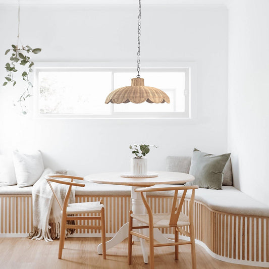 Natural rattan scallop pendant light with woven dome shade and metal hanging chain.