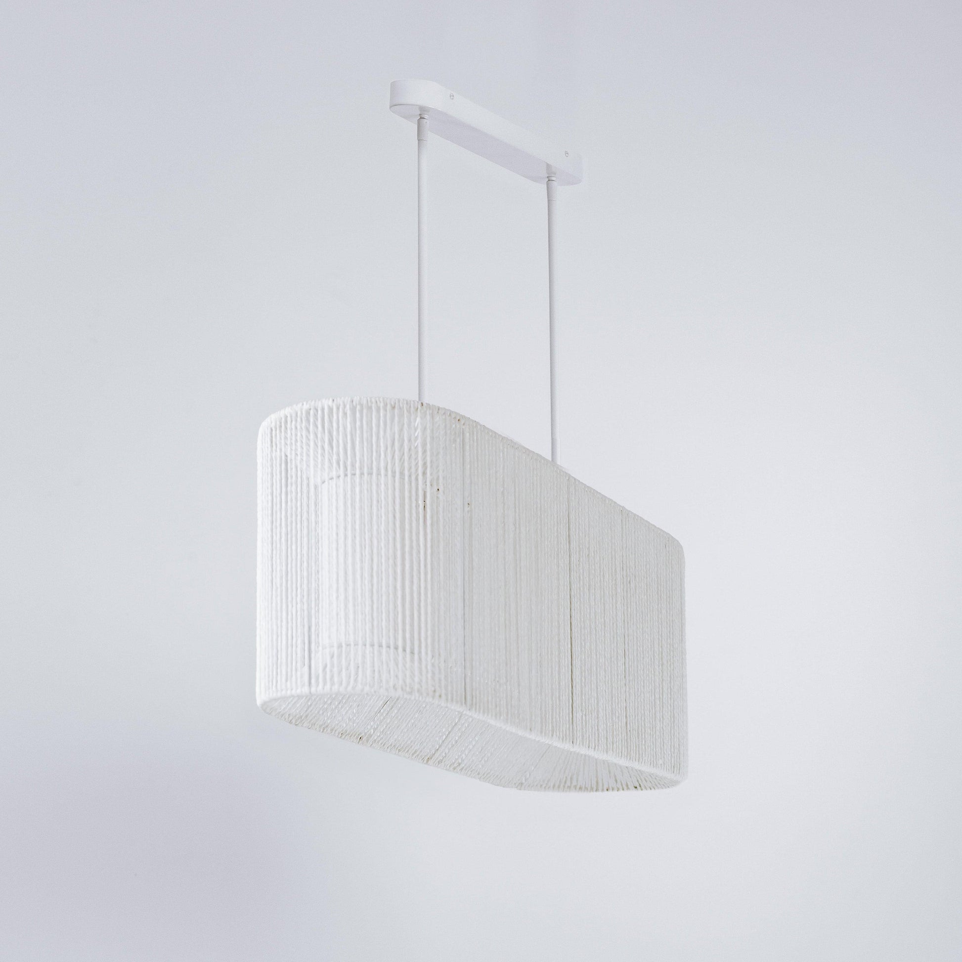 White rope pendant light with arched drum shade and ceiling canopy