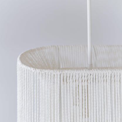 White rope pendant shade close-up with woven vertical strands and cord hanger