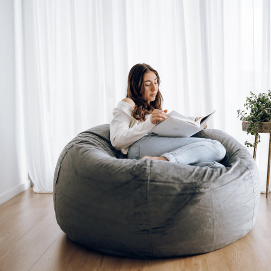 Charcoal round bean bag with cushioned rounded shape and stitched panels