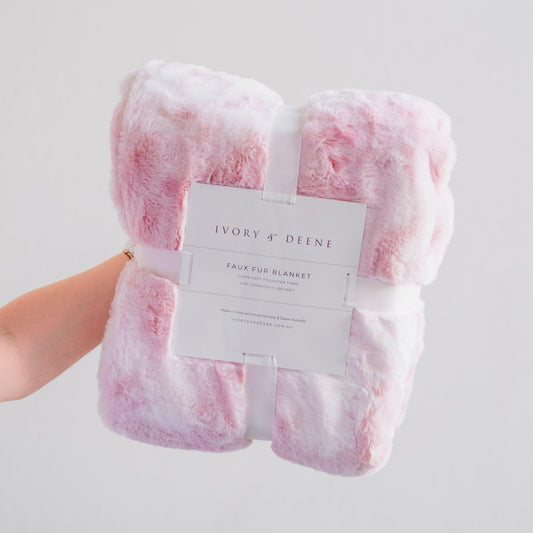 Pink plush faux fur throw blanket, folded and tagged
