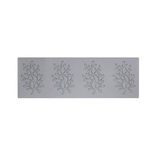 Rectangular embossed metal baking mold with four tree branch patterns