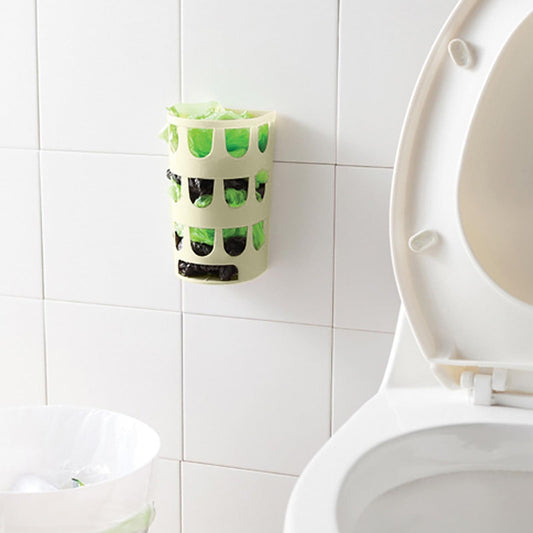 Wall-mounted plastic bag holder rack on bathroom wall, with cutout shelves