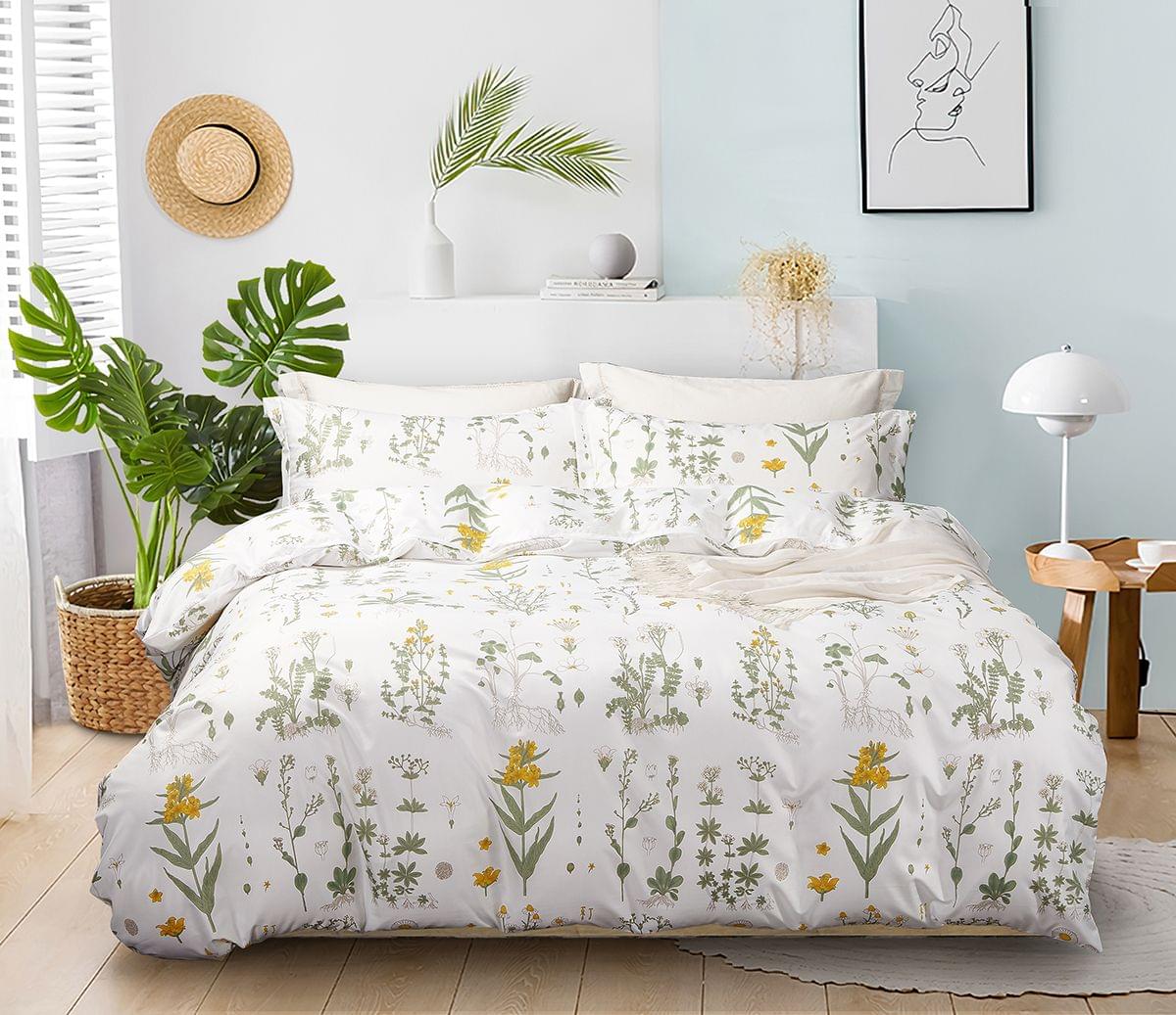 Duvet quilt cover set with white base and green botanical leaf pattern with yellow flowers