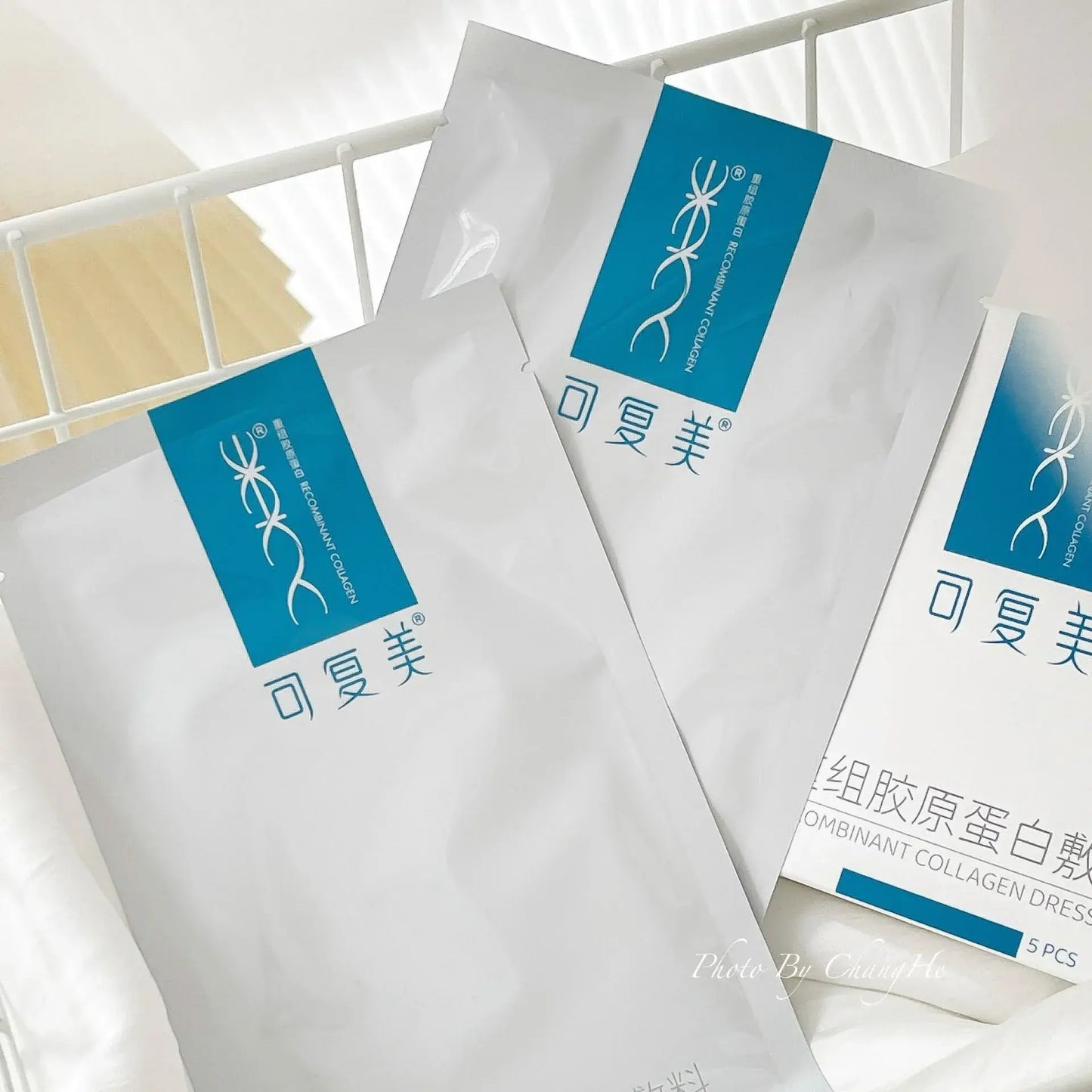 Recombinant collagen dressing sachets, white envelopes with blue rectangular labels
