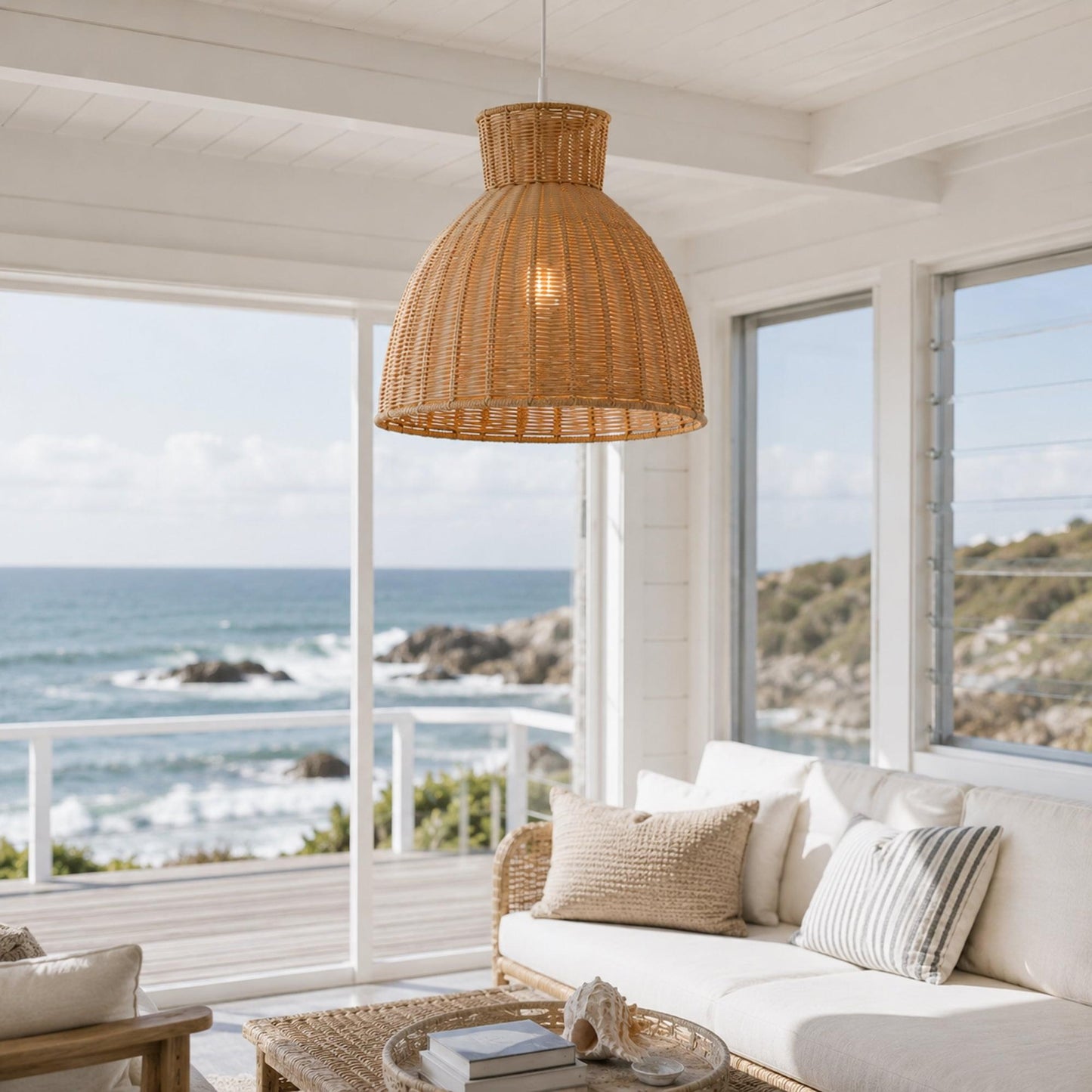 Natural rope pendant light with woven dome shade hanging near large windows