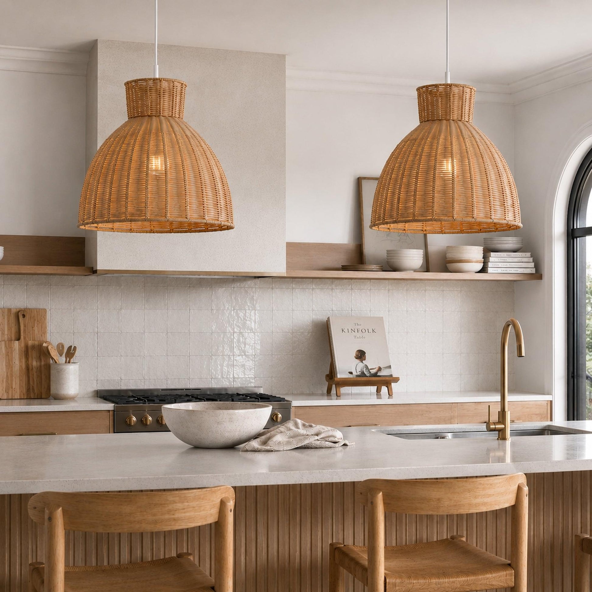 Pair of natural rope pendant lights with woven dome shades over kitchen island