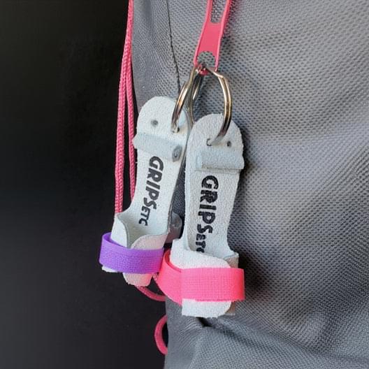 Gymnastics grips key ring with pink fabric strap and metal loop