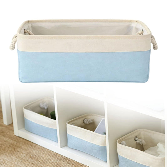 Light blue fabric storage box with beige handles on a shelf, open top visible.