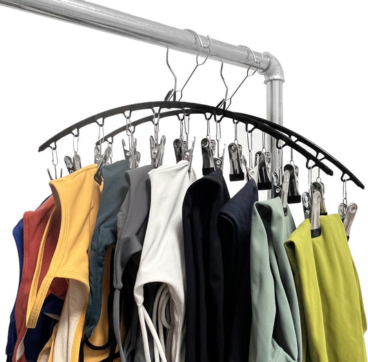 Legging organizer hanger with arched metal bar and multiple clip hooks holding leggings
