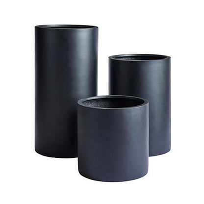 Set of three dark grey matte cylindrical planters, nested sizes.