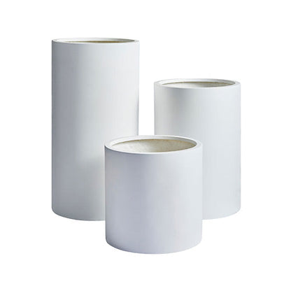 Set of three white cylindrical planters with textured top rims, nested sizes.