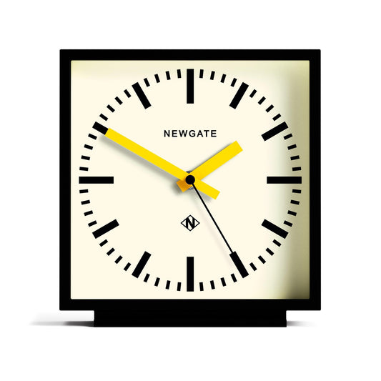 Black mantel clock, cream dial with Newgate logo, yellow hands
