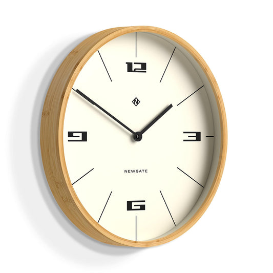 Wall clock with light wood rim and cream face, black hour markers and sweeping hands