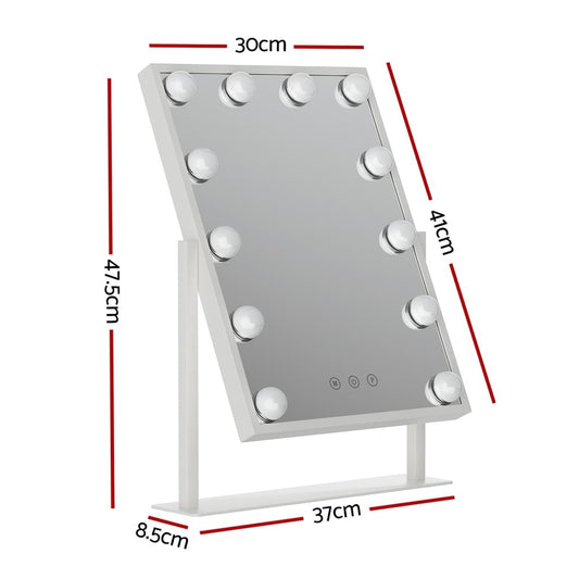 Hollywood vanity mirror on tabletop stand with white LED bulbs around the edges.