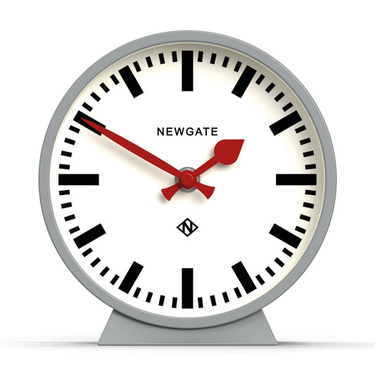 Newgate railway mantel clock with white dial, red hands, and grey stand