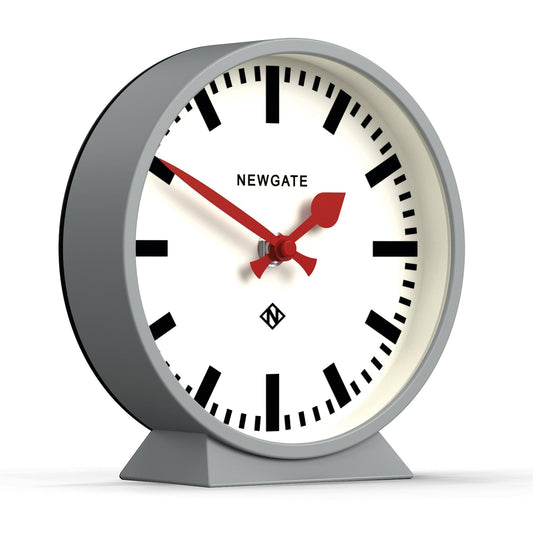 Newgate railway mantel clock with white dial, red hands, on grey angled base