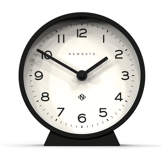 Black mantle clock, black frame, white dial with black hands