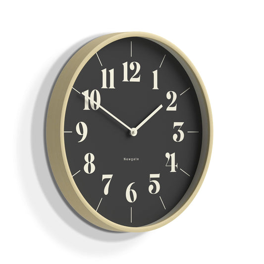 Pale wood-framed wall clock with black dial and gold numeral markers, minute hands
