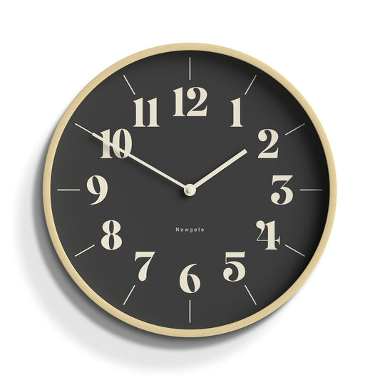 Round wall clock with pale wood rim and black hopscotch-style dial, gold numbers