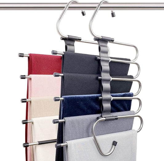 Space-saving pant hanger set with metal clips holding folded scarves and jeans