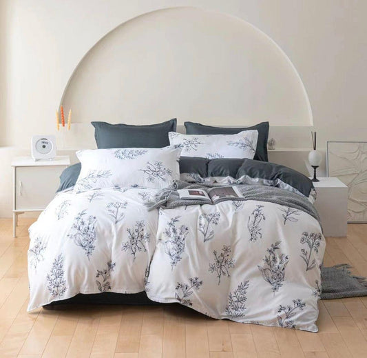 Quilt cover set with white fabric and blue floral pattern, plus matching dark gray cushions