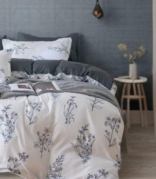 Quilt cover set close-up with white floral print and dark gray quilted pillowcases
