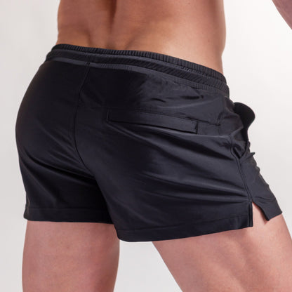 Midnight black 3" swim shorts with side flap pocket and relaxed fit