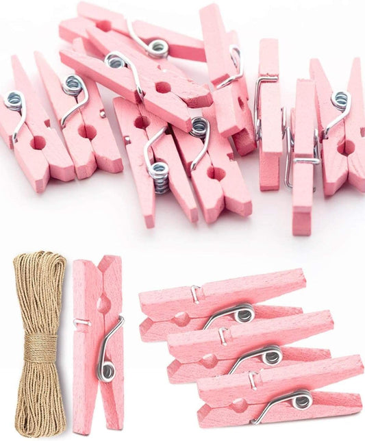 Pink mini wooden clothespins with metal springs, plus small jute twine bundle
