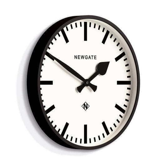 Black-framed wall clock with white dial, black hour markers, Newgate branding and hands.