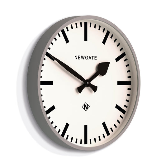 Grey round railway wall clock with white face, black hands, and bold minute markers