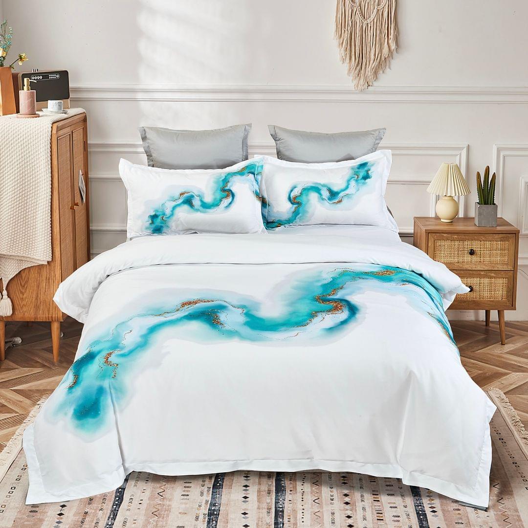 Queen quilt cover set with white base, teal marble swirls, and matching pillow shams