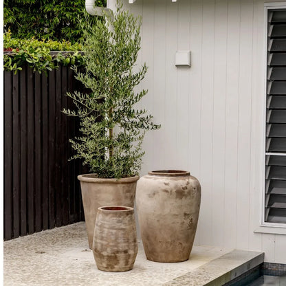 Two tall planter jars with stone texture, off-white mottled finish.