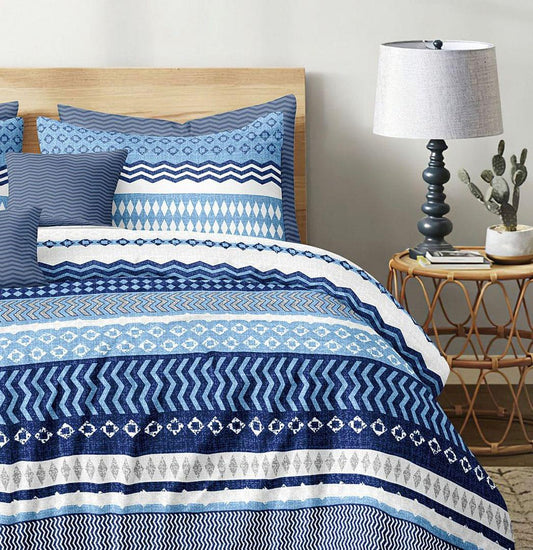 Blue and white patterned quilt and duvet cover set with matching pillow shams