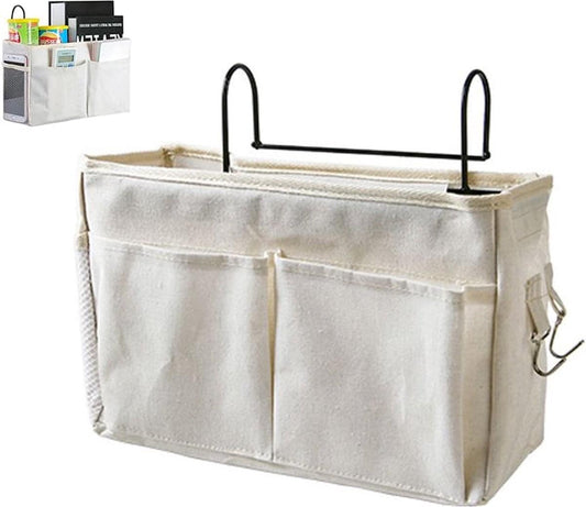 White cotton bedside organizer pocket with frame, three front compartments and black hooks
