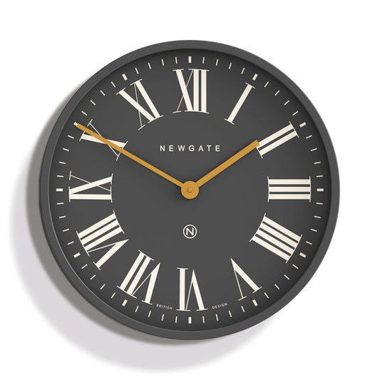Round wall clock with dark slate dial, Roman numeral markers, gold hands