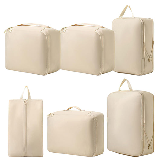 Beige packing cubes with zippered tops: two cubes and a shoe tote bag