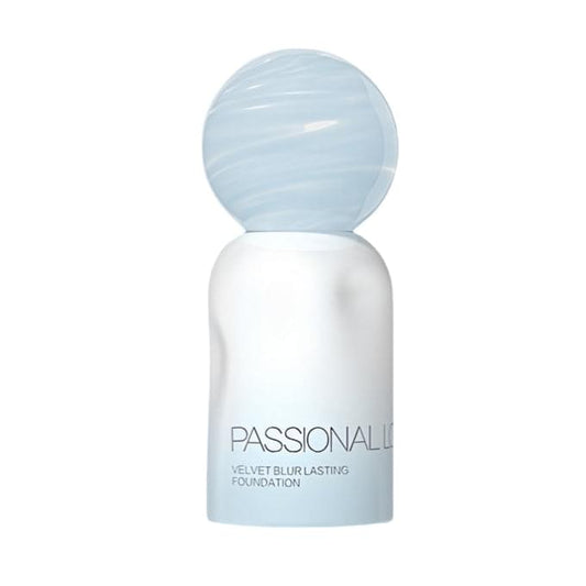 Cream velvet blur foundation bottle with frosted blue cap
