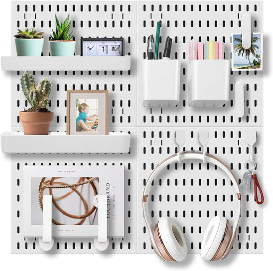 Modular pegboard wall organizer kit with four white boards and accessory holders