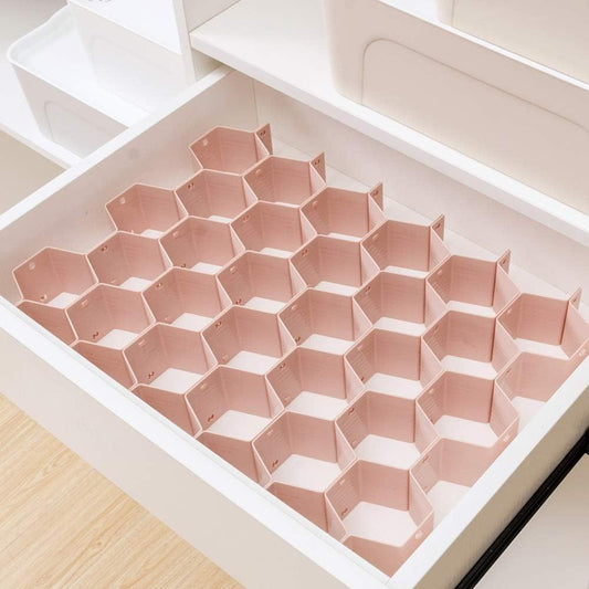 Pink hexagon drawer divider organizer with cubby compartments