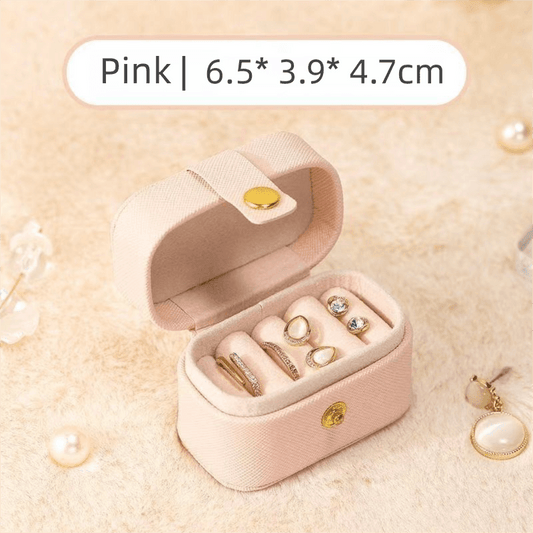 Pink mini jewelry travel case with open compartment for rings and earrings