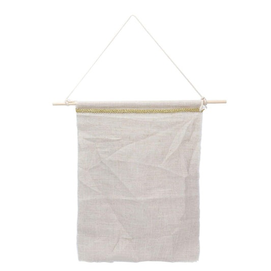 Light beige wall hanging storage bag with gold-trim top rod and hanging cords
