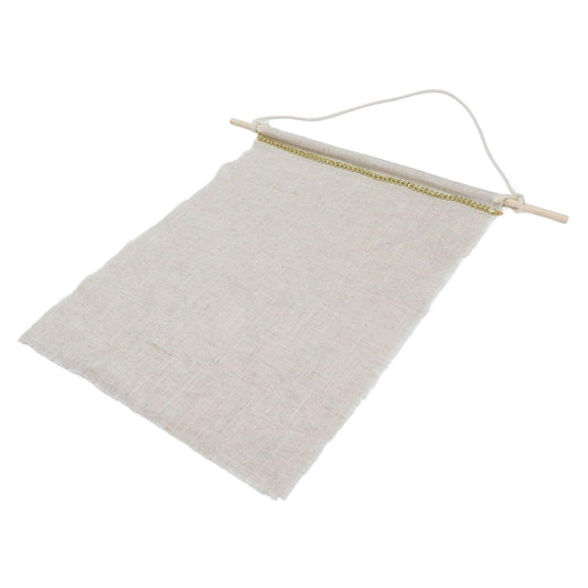 Light beige wall hanging storage bag with gold-trim top rod, slanted view