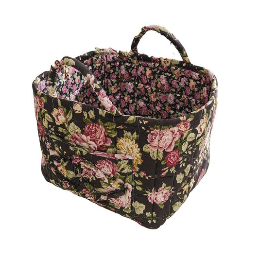 Floral fabric storage basket with handles, dark base with pink and green flowers