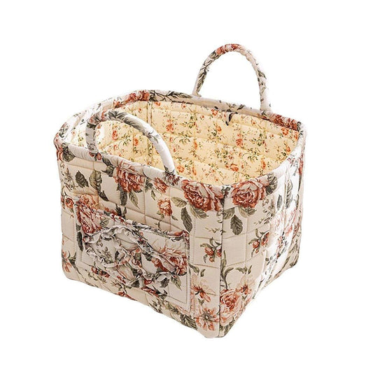 Floral fabric storage basket with handles, beige and red rose print, quilted panels
