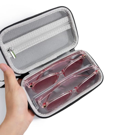 Black EVA sunglasses case open with mesh panel and two pairs in storage slots