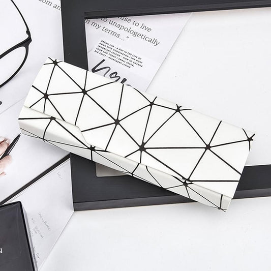 Geometric patterned eyeglass case cover in white with black lines, long rectangular
